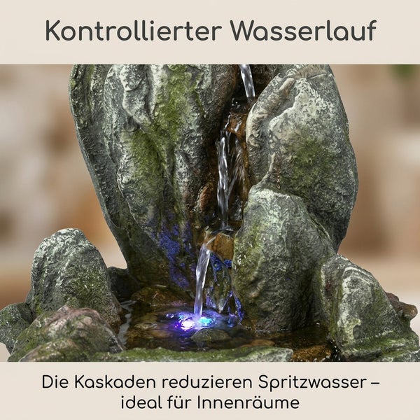 Zimmerbrunnen in Steinoptik mit Kaskaden und LED Beleuchtung für kontrollierten Wasserlauf.