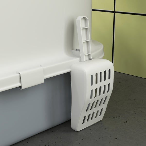 Katzenstreuschaufel aus Kunststoff, befestigt an einer Katzentoilette.