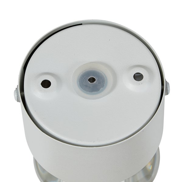 Draufsicht auf einen weißen zylindrischen Leuchtenfuß mit Befestigungslöchern und zentraler Kabeleinführung.