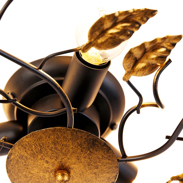 Deckenleuchte mit Blattdekor und Glühbirne