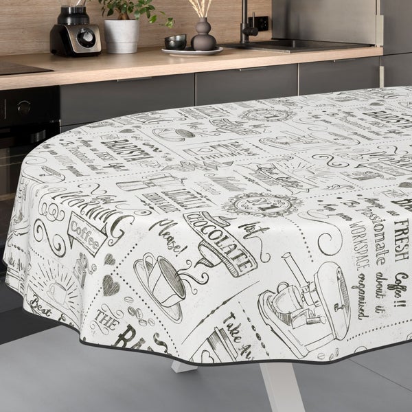 Tischdecke mit Kaffeehaus-Motiv auf einem Küchentisch