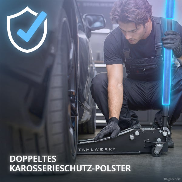 Mechaniker verwendet einen Stahlwerk Rangierwagenheber mit Polster zum Schutz der Karosserie beim Anheben eines Autos in einer Werkstatt.