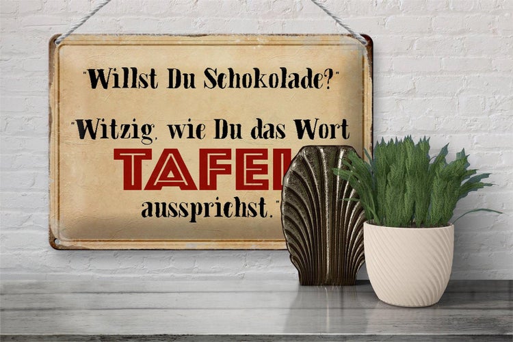 Dekoratives Schild mit dem Text: Willst du Schokolade? Witzig, wie du das Wort Tafel aussprichst.
