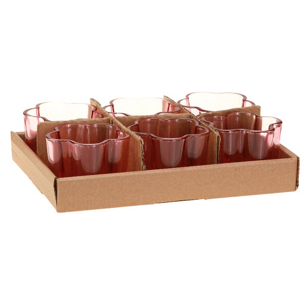 Set aus sechs blütenförmigen Teelichthaltern aus Glas in einer Pappschale.