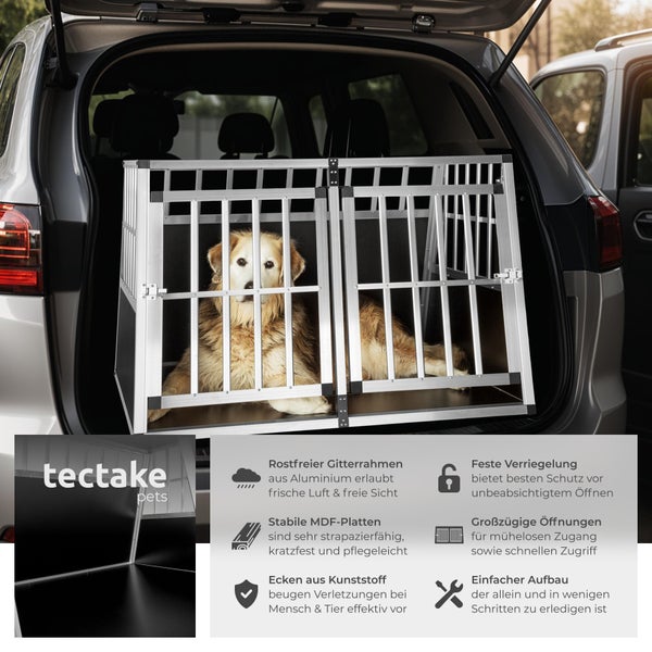 Hundebox aus Aluminium im Kofferraum eines Autos mit einem Hund