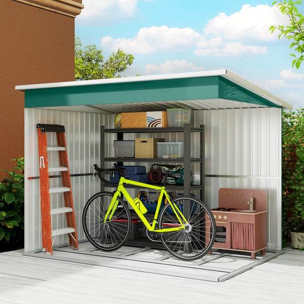 Offener Metallgeräteschuppen mit grünem Dach, befüllt mit Fahrrad, Schwerlastregal und Leiter auf einer hellen Holzterrasse.