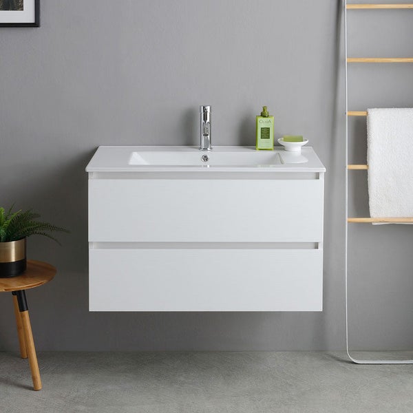 Wandhängender Waschtischunterschrank mit zwei grifflosen Schubladen und integriertem Keramikwaschbecken in einem modernen Badezimmer.