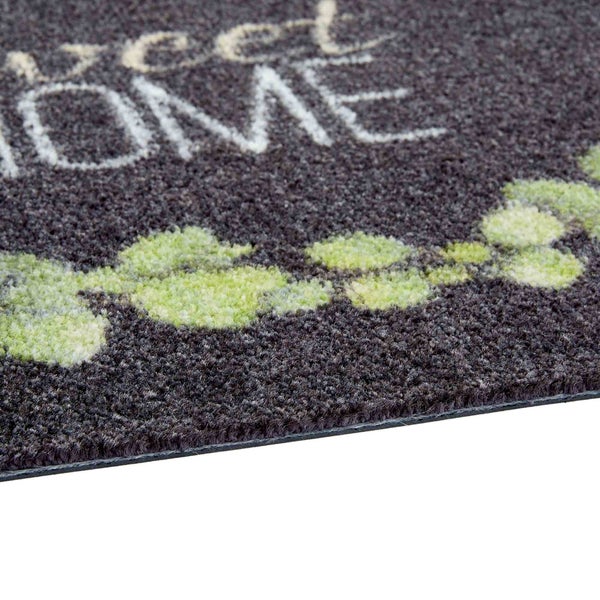 Fußmatte mit dem Schriftzug Willkommen Zuhause und Blumenmuster