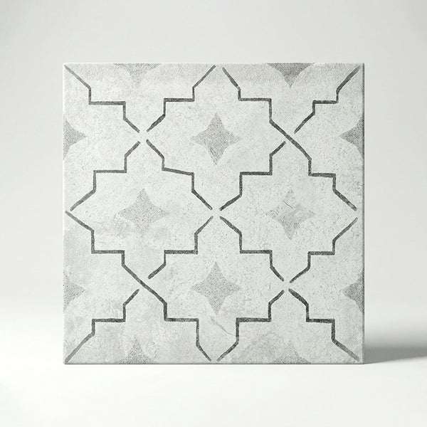 Quadratische Fliese mit geometrischem Sternmuster und strukturierter Oberfläche für Wand und Boden.
