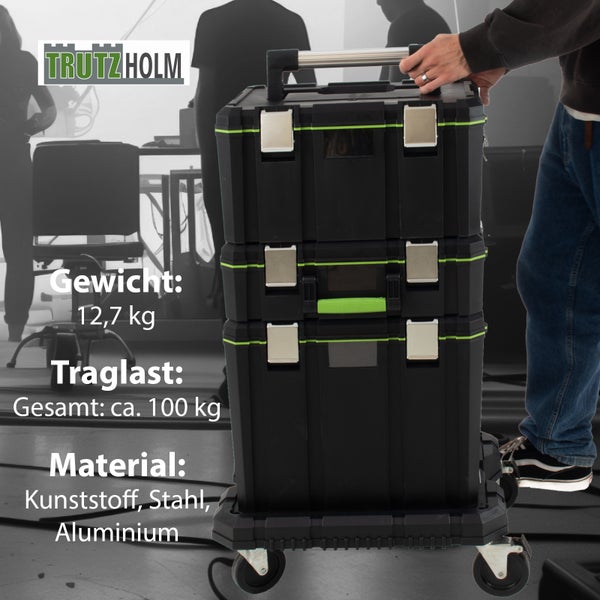 Schwarzer Werkzeugkoffer von TrutzHolm mit Rädern, Teleskopgriff, Tragegriffen und einem Gewicht von 12,7 Kilogramm und einer maximalen Traglast von circa 100 Kilogramm aus Kunststoff, Stahl und Aluminium.