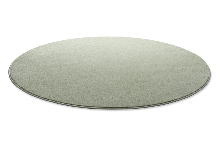 Runder Teppich mit weichem Flor und geketteltem Rand.