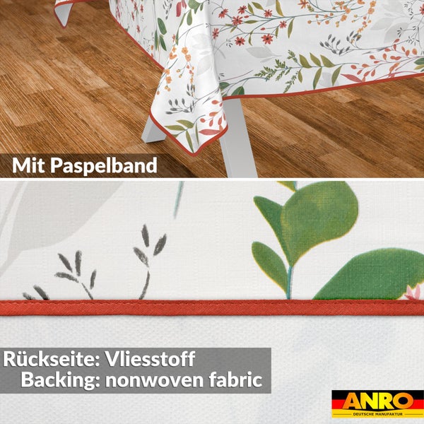 Tischdecke mit Blumenmuster, rotem Paspelband und Rückseite aus Vliesstoff. ANRO Logo.