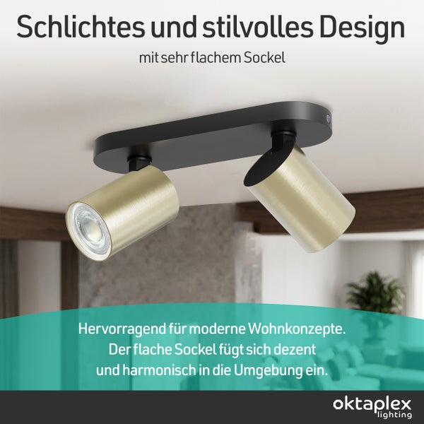 Deckenstrahler mit zwei verstellbaren goldfarbenen Metallspots auf einem flachen schwarzen Sockel. Modernes Design für Wohnräume. oktaplex Logo.