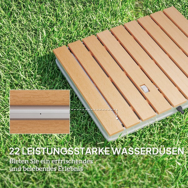 Bodendusche für den Garten mit 22 Wasserdüsen, Detailansicht der Lamellen in Holzoptik auf grünem Rasen.