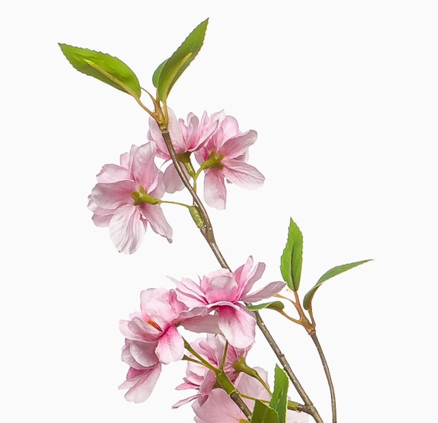 Künstlicher Kirschblütenzweig mit rosafarbenen Blüten und grünen Blättern zur Dekoration.