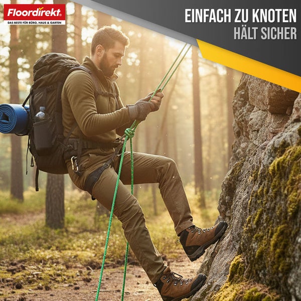 Mann seilt sich mit einem Seil an einem Felsen ab