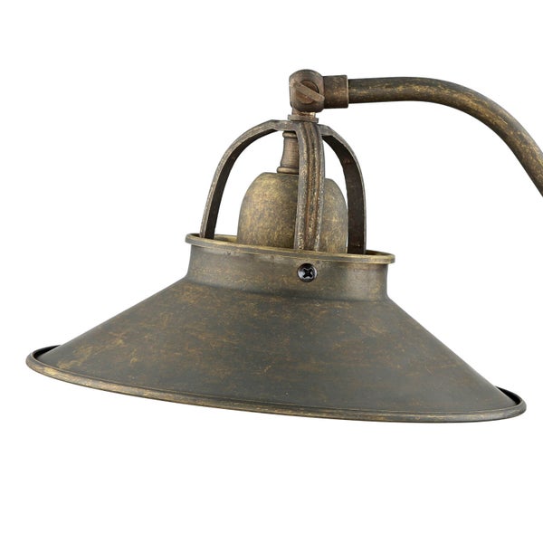 Detailaufnahme einer bronzefarbenen Leuchte mit konischem Schirm