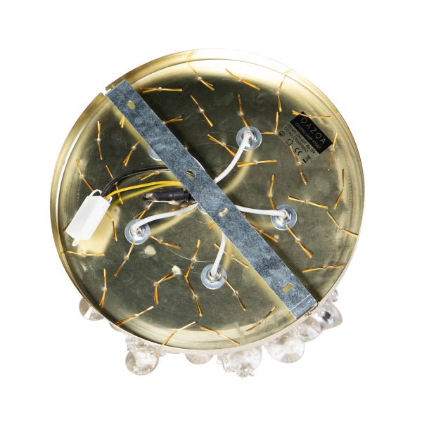 Unterseite einer goldenen Deckenleuchte mit Halterung und Kabeln