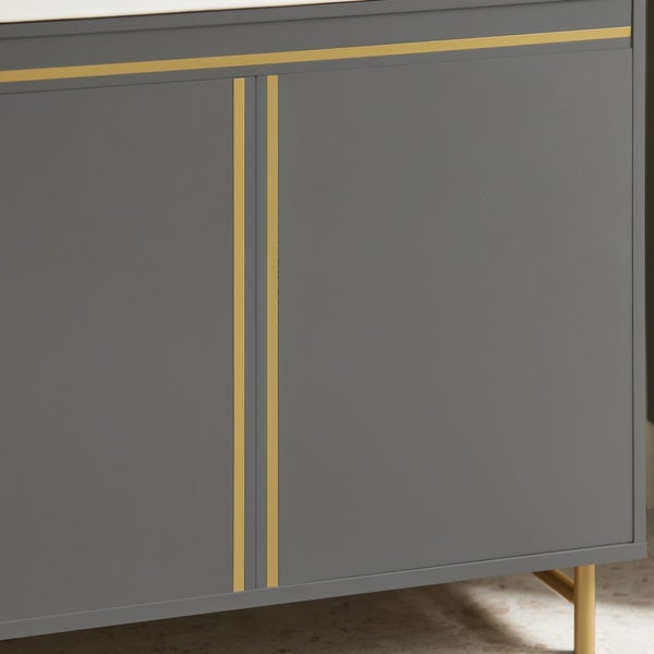 Grauer Unterschrank mit goldenen Zierleisten