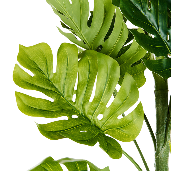 Künstliche Pflanze Monstera deliciosa mit charakteristischen Blättern.