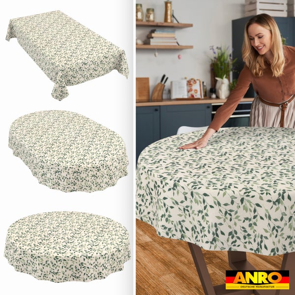 Tischdecken mit Blattmuster in rechteckiger, ovaler und runder Form sowie eine Frau beim Auflegen einer Decke in einer hellen Küche. ANRO Logo.