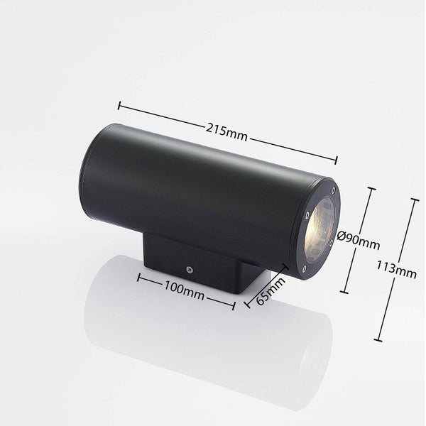 Schwarze zylindrische Wandleuchte mit Maßangaben: Länge 215 Millimeter, Durchmesser 90 Millimeter und Höhe 113 Millimeter.