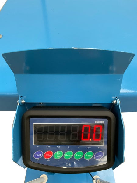 Digitale Anzeige Waage Modell HL318L mit Schutzhaube, Display zeigt Null Komma Null, Bedientasten und Europäische Konformitätskennzeichnung.