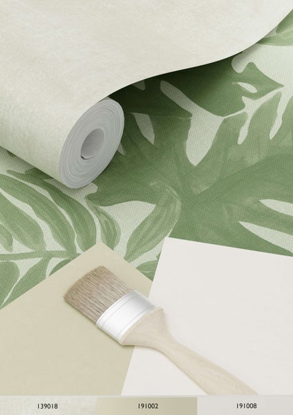 Tapetenrolle mit Blättermuster, Farbfelder und Pinsel