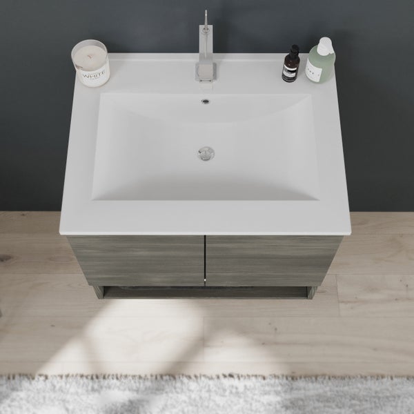 Waschtisch mit Becken, Armatur und Holzunterschrank im Badezimmer