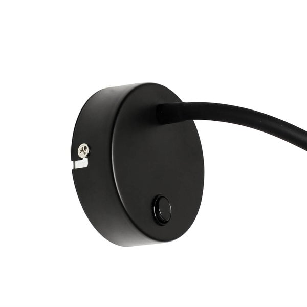 Detailaufnahme einer Wandleuchte mit rundem, schwarzem Sockel und Kabelanschluss