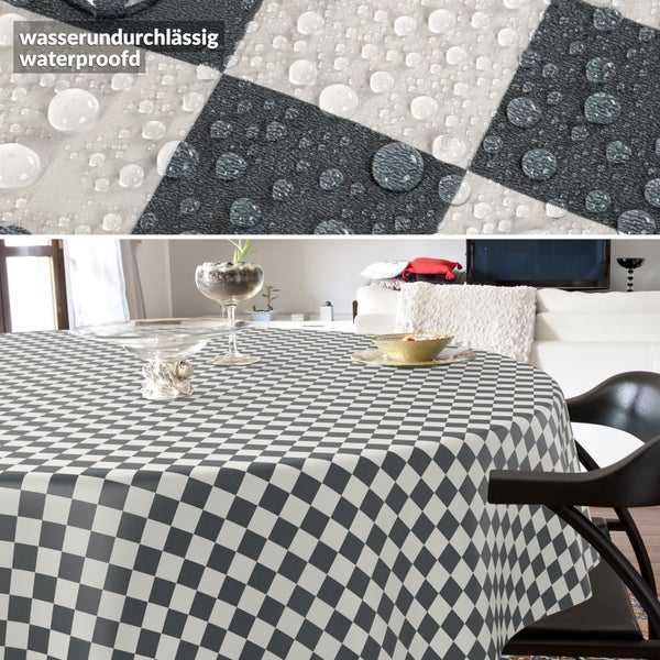 Rundes Tischtuch mit Karomuster, wasserabweisend, in einem modern eingerichteten Wohnzimmer.