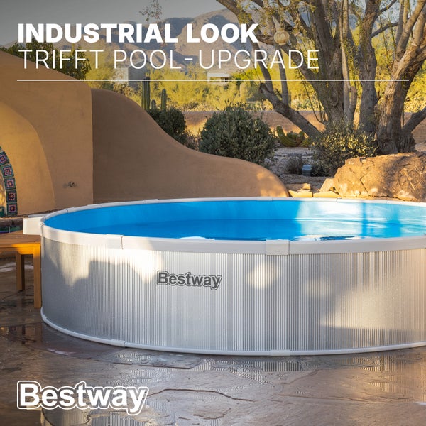 Bestway runder Aufstellpool im Industrial Look mit gewellter Außenwand auf einer Steinterrasse im Garten.