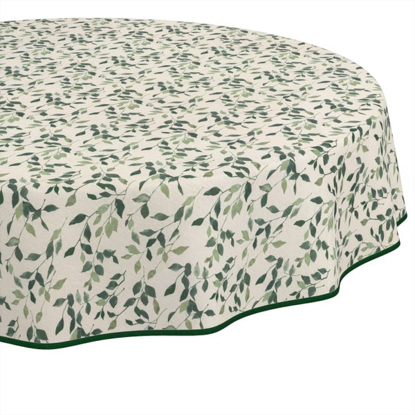 Runde Tischdecke mit grünem Blättermuster.