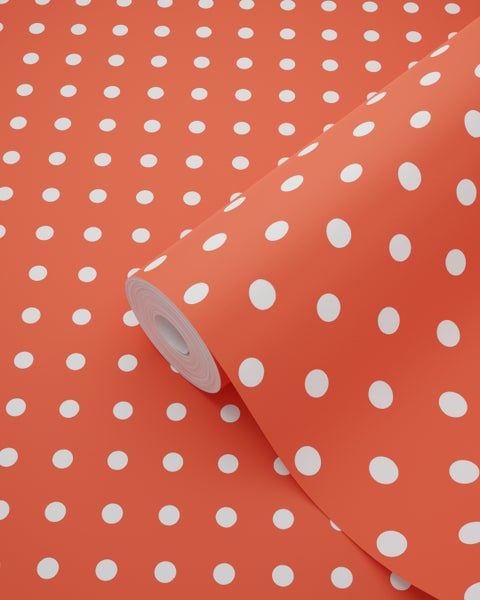 Tapetenrolle mit weißen Punkten auf farbigem Grund