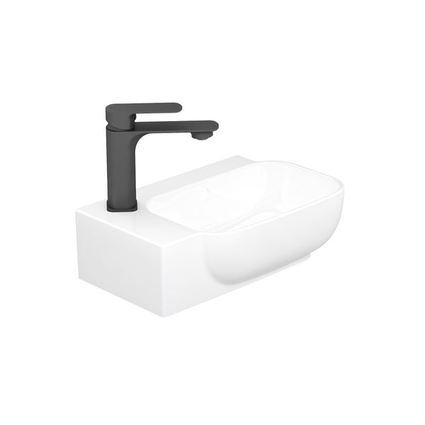 Weißes Handwaschbecken aus Keramik mit einer schwarzen Armatur auf der linken Seite.