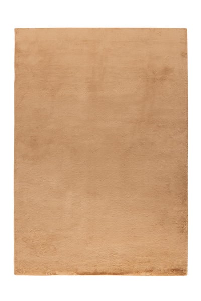 Rechteckiger, weicher Plüschteppich in Beige.