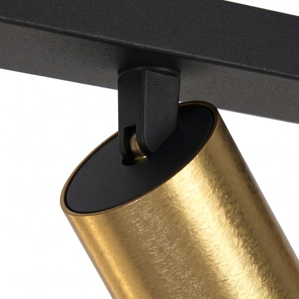 Detailansicht eines schwenkbaren Metallstrahlers für ein Schienensystem mit zylindrischem Leuchtenkopf.