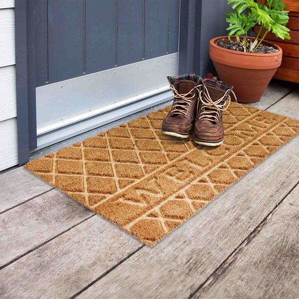 Fußabtreter aus Kokosfaser mit Willkommensgruß und Paar Stiefel