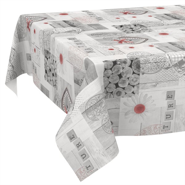Tischdecke mit Patchwork-Muster aus Holzmotiven, Blumen, Herzen und dem Schriftzug Nature.
