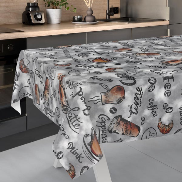 Tischdecke mit Kaffeemotiven wie Cappuccino, Latte und Croissants in einer modernen Küche.
