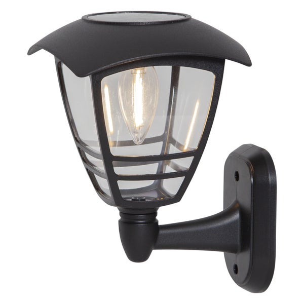 Dekorative Szene mit Holzstuhl, Papierstern, Kerzen und Rahmen