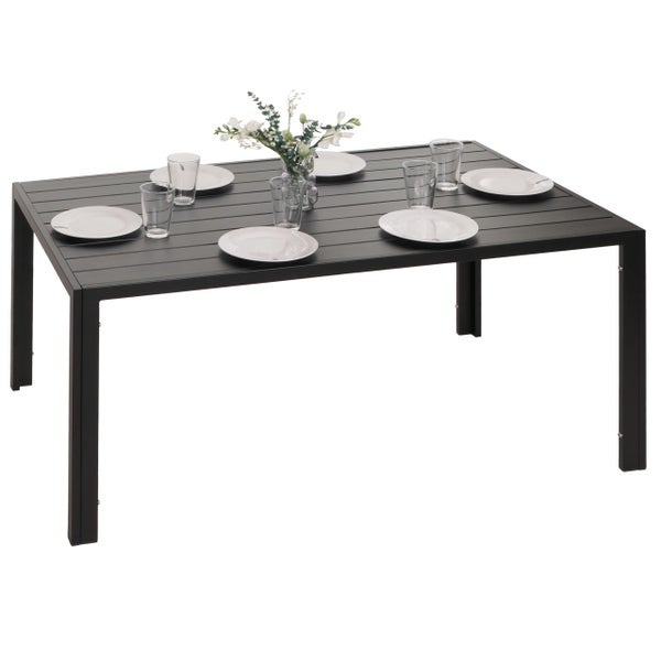 Esstisch aus Metall mit Geschirr und Blumendekoration