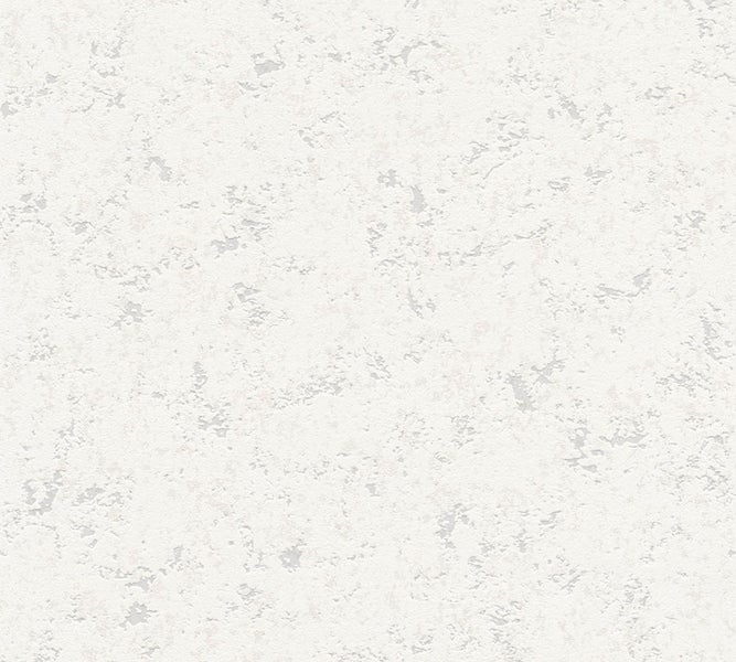 Eine Person bohrt mit einem Bohrhammer in eine Wand.