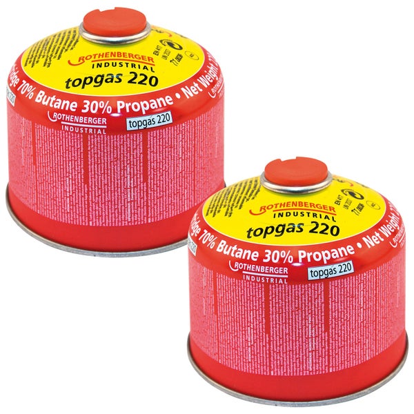 Offene orangefarbene Werkzeugbox aus Kunststoff mit Wabenstruktur im Deckel und Tragegriff.