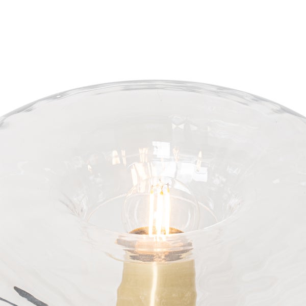 Detailaufnahme einer Tischleuchte mit Glasschirm und Leuchtmittel