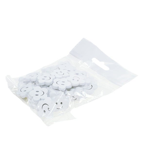 Verpackung mit Dekorstreuteilen in Form von Blumen mit Gesicht