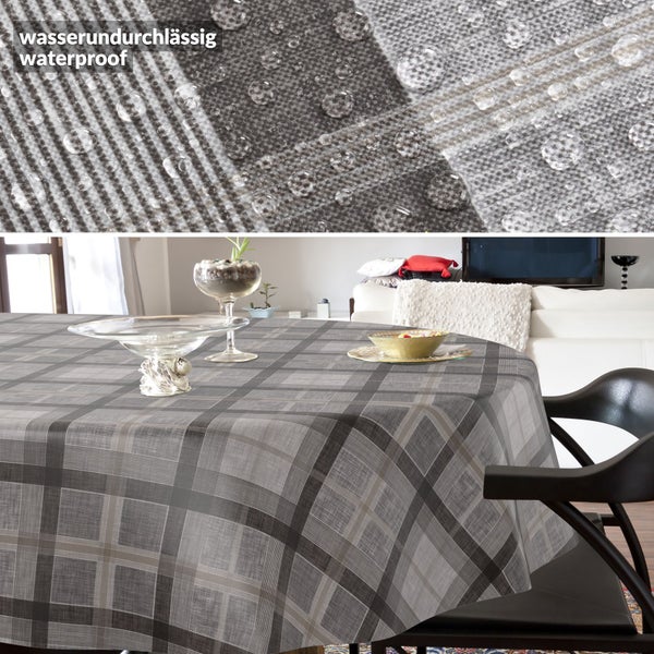 Wasserundurchlässige Tischdecke mit Karomuster, Detailansicht mit Wassertropfen und Darstellung im Wohnzimmer.