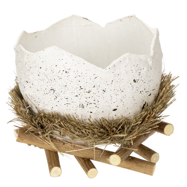 Dekorative Eierschale mit Nest und Holzfuß