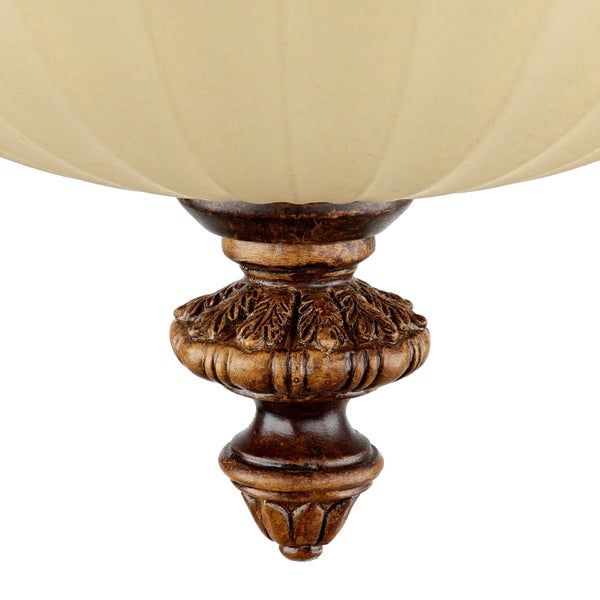 Detailaufnahme einer Pendelleuchte mit Schirm und dekorativem Element