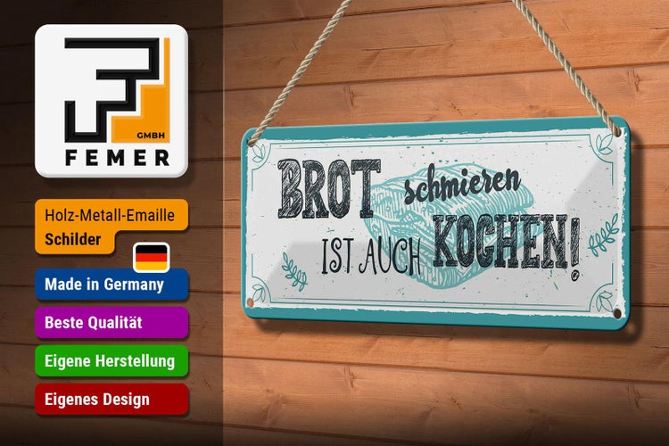 Dekoratives Metallschild mit dem Spruch 'Brot schmieren ist auch kochen!'
